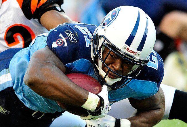 NASHVILLE, TN - NOVEMBER 06:  Javon Ringer #21 of the Tennessee Titans dives for extra yardage as Nate Clements #22 of the Cincinnati Bengals makes the tackle during play at LP Field on November 6, 2011 in Nashville, Tennessee.  (Photo by Grant Halverson/Getty Images)