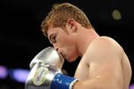 LOS ANGELES, CA - SEPTEMBER 18:  Saul Alvarez of Mexico Carlos kisses his gloves before his match against Baldomir of Argentina in the WBC Super Welterweight Silver Title fight at Staples Center on September 18, 2010 in Los Angeles, California.  (Photo by Harry How/Getty Images)