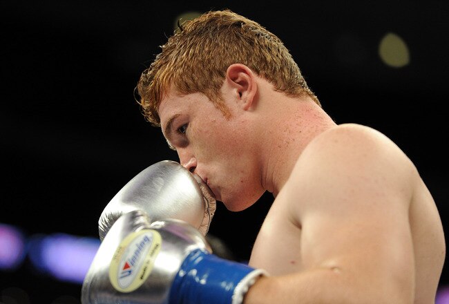 LOS ANGELES, CA - SEPTEMBER 18:  Saul Alvarez of Mexico Carlos kisses his gloves before his match against Baldomir of Argentina in the WBC Super Welterweight Silver Title fight at Staples Center on September 18, 2010 in Los Angeles, California.  (Photo by Harry How/Getty Images)