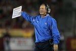 LOS ANGELES, CA - NOVEMBER 26:  Head coach Rick Neuheisel of the UCLA Bruins gestures in the game against the USC Trojans at the Los Angeles Memorial Coliseum on November 26, 2011 in Los Angeles, California.  USC won 50-0.  (Photo by Stephen Dunn/Getty Images)