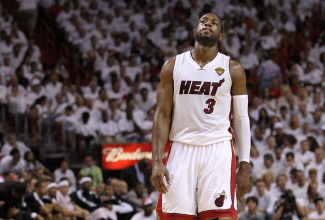 MIAMI, FL - JUNE 12:  Dwyane Wade #3 of the Miami Heat reacts while taking on the Dallas Mavericks in Game Six of the 2011 NBA Finals at American Airlines Arena on June 12, 2011 in Miami, Florida. NOTE TO USER: User expressly acknowledges and agrees that, by downloading and/or using this Photograph, user is consenting to the terms and conditions of the Getty Images License Agreement.  (Photo by Ronald Martinez/Getty Images)