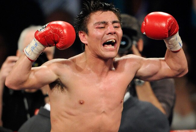 LAS VEGAS, NV - MAY 07:  Jorge Arce celebrates his 12th-round TKO victory over Wilfredo Vazquez in their WBO super bantamweight title fight at the MGM Grand Garden Arena May 7, 2011 in Las Vegas, Nevada.  (Photo by Ethan Miller/Getty Images)