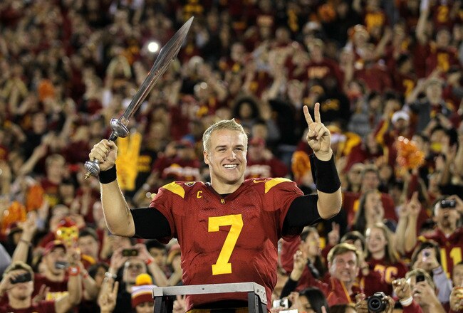 LOS ANGELES, CA - NOVEMBER 26:  Quarterback Matt Barkley #7 of the USC Trojans conducts the band after the game with the UCLA Bruins at the Los Angeles Memorial Coliseum on November 26, 2011 in Los Angeles, California. USC won 50-0.  (Photo by Stephen Dunn/Getty Images)