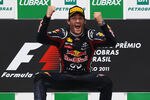 SAO PAULO, BRAZIL - NOVEMBER 27:  Mark Webber of Australia and Red Bull Racing celebrates on the podium after winning the the Brazilian Formula One Grand Prix at the Autodromo Jose Carlos Pace on November 27, 2011 in Sao Paulo, Brazil.  (Photo by Mark Thompson/Getty Images)