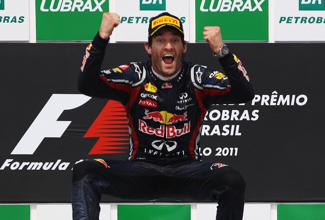 SAO PAULO, BRAZIL - NOVEMBER 27:  Mark Webber of Australia and Red Bull Racing celebrates on the podium after winning the the Brazilian Formula One Grand Prix at the Autodromo Jose Carlos Pace on November 27, 2011 in Sao Paulo, Brazil.  (Photo by Mark Thompson/Getty Images)