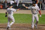 BALTIMORE, MD - SEPTEMBER 27: Marco Scutaro #10 of the Boston Red Sox is congratulated by Carl Crawford #13 (R) after driving him in on a two RBI home run during the sixth inning against the Baltimore Orioles at Oriole Park at Camden Yards on September 27, 2011 in Baltimore, Maryland.  (Photo by Rob Carr/Getty Images)