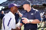 SEATTLE - SEPTEMBER 6:  Head Coach Bronco Mendenhall of the BYU Cougars speaks with Head Coach Tyrone Willingham of the Washington Huskies after their game on September 6, 2008 at Husky Stadium in Seattle, Washington. The Cougars defeated the Huskies 28-27. (Photo by Otto Greule Jr/Getty Images)