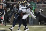 ST. LOUIS, MO - NOVEMBER 20:  Seattle Seahawks wide receiver Sidney Rice #18 scores a touchdown ahead of St. Louis Rams cornerback Justin King #21 in the first half of the game November 20, 2011 at the Edward Jones Dome in St. Louis, Missouri. (Photo by Whitney Curtis/Getty Images)