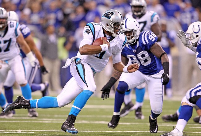 INDIANAPOLIS, IN - NOVEMBER 27:  Cam Newton #1 of the Carolina Panthers runs with the ball during the game against the Indianapolis Colts at Lucas Oil Stadium on November 27, 2011 in Indianapolis, Indiana.  (Photo by Andy Lyons/Getty Images)