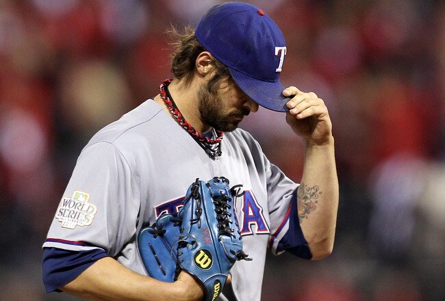 ST LOUIS, MO - OCTOBER 28:  C.J. Wilson #36 of the Texas Rangers stands on the mound in the sixth inning during Game Seven of the MLB World Series against the St. Louis Cardinals at Busch Stadium on October 28, 2011 in St Louis, Missouri.  (Photo by Ezra Shaw/Getty Images)