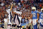 SAN DIEGO, CA - NOVEMBER 27:   Matt Prater #5 of the Denver Broncos kicks the winning field goal against the San Diego Chargers as Britton Colquitt #4 and Lonie Paxton #66 celebrate and Eric Weddle #32 of the Chargers looks on during the Broncos 16-13 overtime win in their NFL Game on November 27, 2011 at Qualcomm Stadium in San Diego, California  (Photo by Donald Miralle/Getty Images)