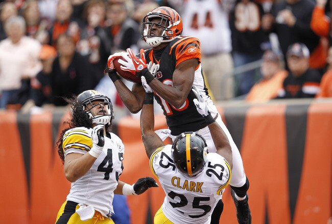 CINCINNATI, OH - NOVEMBER 13: A.J. Green #18 of the Cincinnati Bengals makes a 36-yard touchdown reception in the first quarter over Ryan Clark #25 and Troy Polamalu #43 of the Pittsburgh Steelers at Paul Brown Stadium on November 13, 2011 in Cincinnati, Ohio. (Photo by Joe Robbins/Getty Images)
