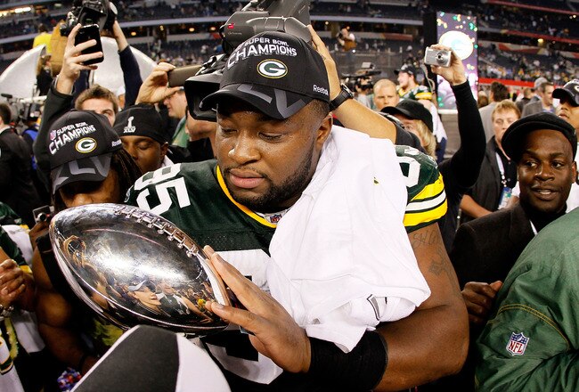 ARLINGTON, TX - FEBRUARY 06:  Howard Green #95 of the Green Bay Packers holds the Vince Lombardi trophy after the Packers won 31-25 against the Pittsburgh Steelers during Super Bowl XLV at Cowboys Stadium on February 6, 2011 in Arlington, Texas.  (Photo by Kevin C. Cox/Getty Images)
