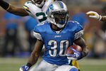 DETROIT, MI - NOVEMBER 24:  Running back Kevin Smith #30 of the Detroit Lions runs the ball in the first quarter against the Green Bay Packers during the Thanksgiving Day game at Ford Field on November 24, 2011 in Detroit, Michigan.  (Photo by Gregory Shamus/Getty Images)