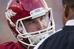 BATON ROUGE, LA - NOVEMBER 25:   Quarterback Tyler Wilson #8 talks with quarterback coach Garrick McGee of the Arkansas Razorbacks during a game against the LSU Tigers at Tiger Stadium on November 25, 2011 in Baton Rouge, Louisiana.  The Tigers defeated the Razorbacks 41 to 17.  (Photo by Wesley Hitt/Getty Images)