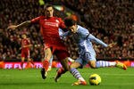 LIVERPOOL, ENGLAND - NOVEMBER 27:   David Silva of Manchester City is challenged by Daniel Agger of Liverpool during the Barclays Premier League match between Liverpool and Manchester City at Anfield on November 27, 2011 in Liverpool, England. (Photo by Alex Livesey/Getty Images)
