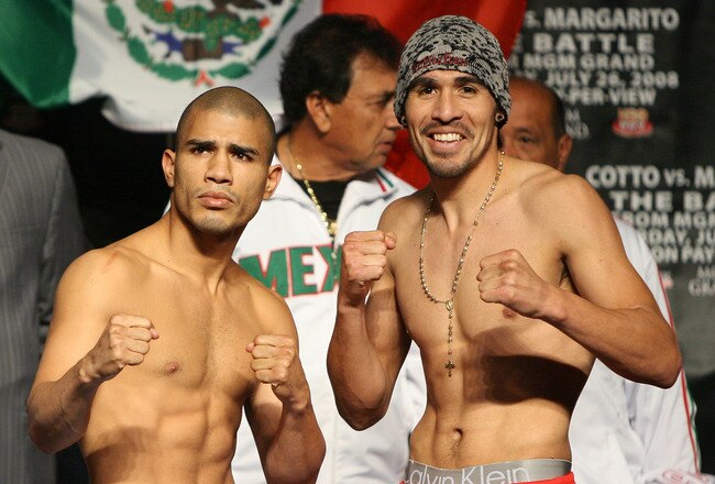 LAS VEGAS - JULY 25:  Miguel Cotto of Puerto Rico (L) and Antonio Margarito of Mexico pose during their official weigh-in at the MGM Grand Garden Arena July 25, 2008 in Las Vegas, Nevada. Cotto will defend his WBA welterweight title against Margarito on July 26.  (Photo by Ethan Miller/Getty Images)