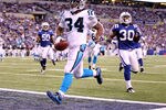 INDIANAPOLIS, IN - NOVEMBER 27:  DeAngelo Williams #34 of the Carolina Panthers runs for a touchdown during the game against the Indianapolis Colts at Lucas Oil Stadium on November 27, 2011 in Indianapolis, Indiana.  (Photo by Andy Lyons/Getty Images)