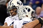 ARLINGTON, TX - OCTOBER 28:  Players of the BYU Cougars celebrate during a game against the TCU Horned Frogs at Cowboys Stadium on October 28, 2011 in Arlington, Texas. The TCU Horned Frogs defeated the BYU Cougars 38-28.  (Photo by Sarah Glenn/Getty Images)