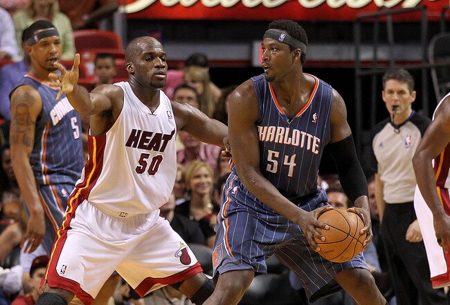 MIAMI, FL - APRIL 08:  Kwame Brown #54 of the Charlotte Bobcats posts up Joel Anthony #50 of the Miami Heat during a game at American Airlines Arena on April 8, 2011 in Miami, Florida. NOTE TO USER: User expressly acknowledges and agrees that, by downloading and/or using this Photograph, User is consenting to the terms and conditions of the Getty Images License Agreement.  (Photo by Mike Ehrmann/Getty Images)