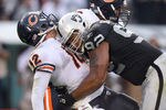 OAKLAND, CA - NOVEMBER 27:  Richard Seymour #92 of the Oakland Raiders hits Caleb Hanie #12 of the Chicago Bears after Hanie threw the ball at O.co Coliseum on November 27, 2011 in Oakland, California.  (Photo by Ezra Shaw/Getty Images)