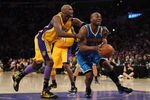 LOS ANGELES, CA - APRIL 26:  Carl Landry #24 of the New Orleans Hornets is grabbed from behind by Lamar Odom #7 of the Los Angeles Lakers in the fourth quarter in Game Five of the Western Conference Quarterfinals in the 2011 NBA Playoffs on April 26, 2011 at Staples Center in Los Angeles, California. NOTE TO USER: User expressly acknowledges and agrees that, by downloading and or using this photograph, User is consenting to the terms and conditions of the Getty Images License Agreement.  (Photo by Harry How/Getty Images)