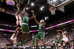MIAMI, FL - MAY 03:  LeBron James #6 of the Miami Heat shoots over Glen Davis #11 and Jeff Green #8 of  the Boston Celtics during Game Two of the Eastern Conference Semifinals of the 2011 NBA Playoffs at American Airlines Arena on May 3, 2011 in Miami, Florida. NOTE TO USER: User expressly acknowledges and agrees that, by downloading and/or using this Photograph, User is consenting to the terms and conditions of the Getty Images License Agreement.  (Photo by Mike Ehrmann/Getty Images)