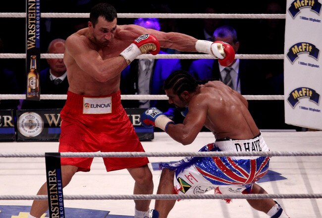 HAMBURG, GERMANY - JULY 02:  David Haye of England ducks from a left hook of Wladimir Klitschko of the Ukraine during their heavy weight unification match at the Imtech Arena on July 2, 2011 in Hamburg, Germany.  (Photo by Scott Heavey/Getty Images)