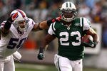 EAST RUTHERFORD, NJ - NOVEMBER 27:  Shonn Greene #23 of the New York Jets rund with the ball as  Nick Barnett #50 of the Buffalo Bills defends during their game on November 27, 2011 at  MetLife Stadium in East Rutherford, New Jersey.  (Photo by Al Bello/Getty Images)