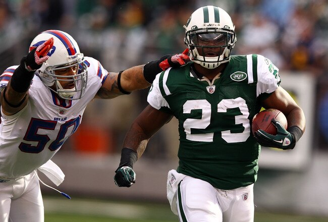 EAST RUTHERFORD, NJ - NOVEMBER 27:  Shonn Greene #23 of the New York Jets rund with the ball as  Nick Barnett #50 of the Buffalo Bills defends during their game on November 27, 2011 at  MetLife Stadium in East Rutherford, New Jersey.  (Photo by Al Bello/Getty Images)