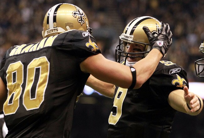 NEW ORLEANS, LA - NOVEMBER 28:  Drew Brees #9 of the New Orleans Saints celebrates his touchdown with  Jimmy Graham #80 against the New York Giants at Mercedes-Benz Superdome on November 28, 2011 in New Orleans, Louisiana.  (Photo by Ronald Martinez/Getty Images)