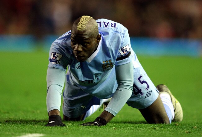 LIVERPOOL, ENGLAND - NOVEMBER 27:  Mario Balotelli of Manchester City looks on during the Barclays Premier League match between Liverpool and Manchester City at Anfield on November 27, 2011 in Liverpool, England.  (Photo by Alex Livesey/Getty Images)