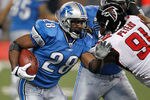 DETROIT, MI - OCTOBER 23:  Maurice Morris #28 of the Detroit Lions tries to get around the tackle of  Corey Peters #91 of the Atlanta Falcons during a first quarter run at Ford Field on October 23, 2011 in Detroit, Michigan.  (Photo by Gregory Shamus/Getty Images)