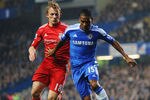 LONDON, ENGLAND - NOVEMBER 20: Dirk Kuyt of Liverpool closes down Florent Malouda of Chelsea during the Barclays Premier League match between Chelsea and Liverpool at Stamford Bridge on November 20, 2011 in London, England.  (Photo by Mike Hewitt/Getty Images)