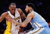 LOS ANGELES, CA - APRIL 03:  Kobe Bryant #24 of the Los Angeles Lakers drives against Wilson Chandler #21 of the Denver Nuggets during the game at Staples Center on April 3, 2011 in Los Angeles, California. NOTE TO USER: User expressly acknowledges and agrees that, by downloading and or using this photograph, User is consenting to the terms and conditions of the Getty Images License Agreement.  (Photo by Kevork Djansezian/Getty Images)
