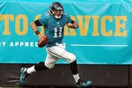 JACKSONVILLE, FL - NOVEMBER 27:   Blaine Gabbert #11 of the Jacksonville Jaguars scrambles for yardage during the game against the Houston Texans at EverBank Field on November 27, 2011 in Jacksonville, Florida.  (Photo by Sam Greenwood/Getty Images)
