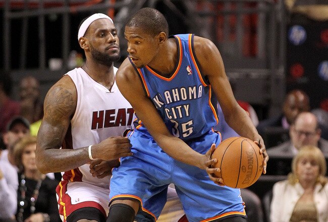 MIAMI, FL - MARCH 16:  LeBron James #6 of the Miami Heat guards Kevin Durant #35 of the Oklahoma City Thunder during a game at American Airlines Arena on March 16, 2011 in Miami, Florida. NOTE TO USER: User expressly acknowledges and agrees that, by downloading and/or using this Photograph, User is consenting to the terms and conditions of the Getty Images License Agreement.  (Photo by Mike Ehrmann/Getty Images)
