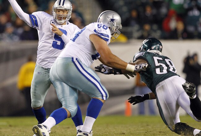 PHILADELPHIA, PA - OCTOBER 30: Tony Romo #9 the Dallas Cowboys passes as teammate Doug Free #68 blocks defensive end Trent Cole #58 of the the Philadelphia Eagles at Lincoln Financial Field on October 30, 2011 in Philadelphia, Pennsylvania. The Eagles defeated the Cowboys 34-7. (Photo by Rich Schultz /Getty Images)