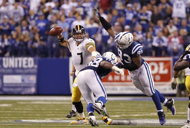 INDIANAPOLIS, IN - SEPTEMBER 25: Ben Roethlisberger #7 of the Pittsburgh Steelers looks to pass while under pressure from Dwight Freeney #93 and Robert Mathis #98 of the Indianapolis Colts at Lucas Oil Stadium on September 25, 2011 in Indianapolis, Indiana. The Steelers won 23-20. (Photo by Joe Robbins/Getty Images)