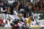 HONOLULU - SEPTEMBER 02: Ronald Johnson #83 of the University of Southern California Trojans is taken down by Po'okela Ahmad #40 of the University of Hawaii Warriors during first half action against the University of Southern California Trojans at Aloha Stadium September 2, 2010 in Honolulu, Hawaii. (Photo by Kent Nishimura/Getty Images)