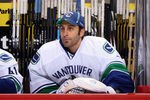 GLENDALE, AZ - NOVEMBER 25:  Goaltender Roberto Luongo #1 of the Vancouver Canucks watches from the bench during the NHL game against the Phoenix Coyotes at Jobing.com Arena on November 25 2011 in Glendale, Arizona.  The Canucks defeated the Coyotes 5-0.  (Photo by Christian Petersen/Getty Images)