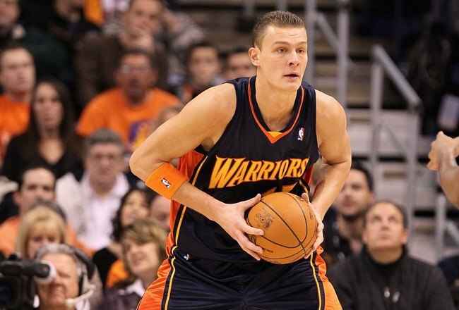 PHOENIX - JANUARY 23:  Andris Biedrins #15 of the Golden State Warriors during the NBA game against the Phoenix Suns at US Airways Center on January 23, 2010 in Phoenix, Arizona. The Suns defeated the Warriors 112-103.  NOTE TO USER: User expressly acknowledges and agrees that, by downloading and or using this photograph, User is consenting to the terms and conditions of the Getty Images License Agreement.  (Photo by Christian Petersen/Getty Images)