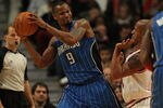 CHICAGO, IL - DECEMBER 01: Rashard Lewis #9 of the Orlando Magic looks to pass under pressure from Keith Bogans #6 of the Chicago Bulls at the United Center on December 1, 2010 in Chicago, Illinois. The Magic defeated the Bulls 107-78. NOTE TO USER: User expressly acknowledges and agrees that, by downloading and/or using this Photograph, User is consenting to the terms and conditions of the Getty Images License Agreement.  (Photo by Jonathan Daniel/Getty Images)