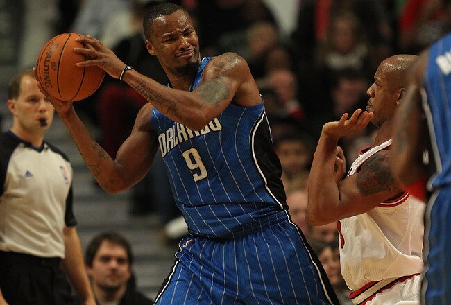 CHICAGO, IL - DECEMBER 01: Rashard Lewis #9 of the Orlando Magic looks to pass under pressure from Keith Bogans #6 of the Chicago Bulls at the United Center on December 1, 2010 in Chicago, Illinois. The Magic defeated the Bulls 107-78. NOTE TO USER: User expressly acknowledges and agrees that, by downloading and/or using this Photograph, User is consenting to the terms and conditions of the Getty Images License Agreement.  (Photo by Jonathan Daniel/Getty Images)