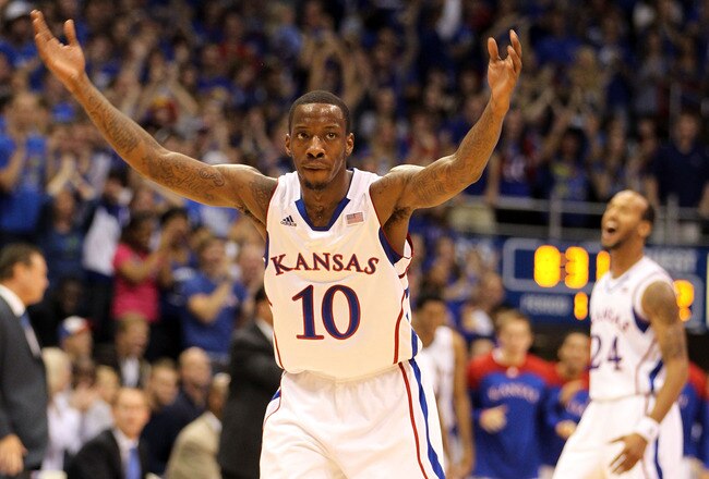 LAWRENCE, KS - NOVEMBER 11:  Tyshawn Taylor #10 of the Kansas Jayhawks reacts after scoring during the game against the Towson Tigers on November 11, 2011 at Allen Fieldhouse in Lawrence, Kansas.  (Photo by Jamie Squire/Getty Images)
