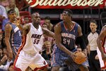 MIAMI, FL - APRIL 08:  Kwame Brown #54 of the Charlotte Bobcats posts up Joel Anthony #50 of the Miami Heat during a game at American Airlines Arena on April 8, 2011 in Miami, Florida. NOTE TO USER: User expressly acknowledges and agrees that, by downloading and/or using this Photograph, User is consenting to the terms and conditions of the Getty Images License Agreement.  (Photo by Mike Ehrmann/Getty Images)