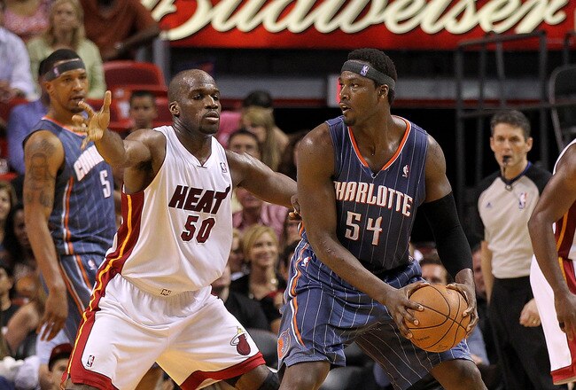 MIAMI, FL - APRIL 08:  Kwame Brown #54 of the Charlotte Bobcats posts up Joel Anthony #50 of the Miami Heat during a game at American Airlines Arena on April 8, 2011 in Miami, Florida. NOTE TO USER: User expressly acknowledges and agrees that, by downloading and/or using this Photograph, User is consenting to the terms and conditions of the Getty Images License Agreement.  (Photo by Mike Ehrmann/Getty Images)