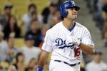 LOS ANGELES, CA - AUGUST 30:  Andre Ethier #16 of the Los Angeles Dodgers hits a grand slam homerun against the San Diego Padres during the second inning at Dodger Stadium on August 30, 2011 in Los Angeles, California.  (Photo by Harry How/Getty Images)