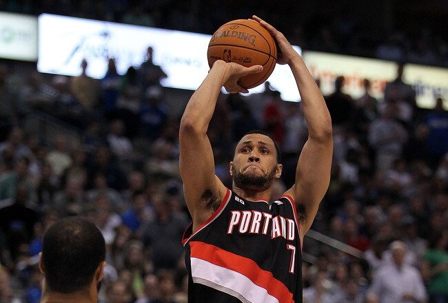 DALLAS, TX - APRIL 25:  Guard Brandon Roy #7 of the Portland Trail Blazers takes a shot against Tyson Chandler #6 of the Dallas Mavericks in Game Five of the Western Conference Quarterfinals during the 2011 NBA Playoffs on April 25, 2011 at American Airlines Center in Dallas, Texas.  NOTE TO USER: User expressly acknowledges and agrees that, by downloading and or using this photograph, User is consenting to the terms and conditions of the Getty Images License Agreement.  (Photo by Ronald Martinez/Getty Images)
