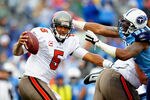 NASHVILLE, TN - NOVEMBER 27:  Jason Jones #91 of the Tennessee Titans pressures quarterback Josh Freeman #5 of the Tampa Bay Buccaneers during play at LP Field on November 27, 2011 in Nashville, Tennessee.  (Photo by Grant Halverson/Getty Images)